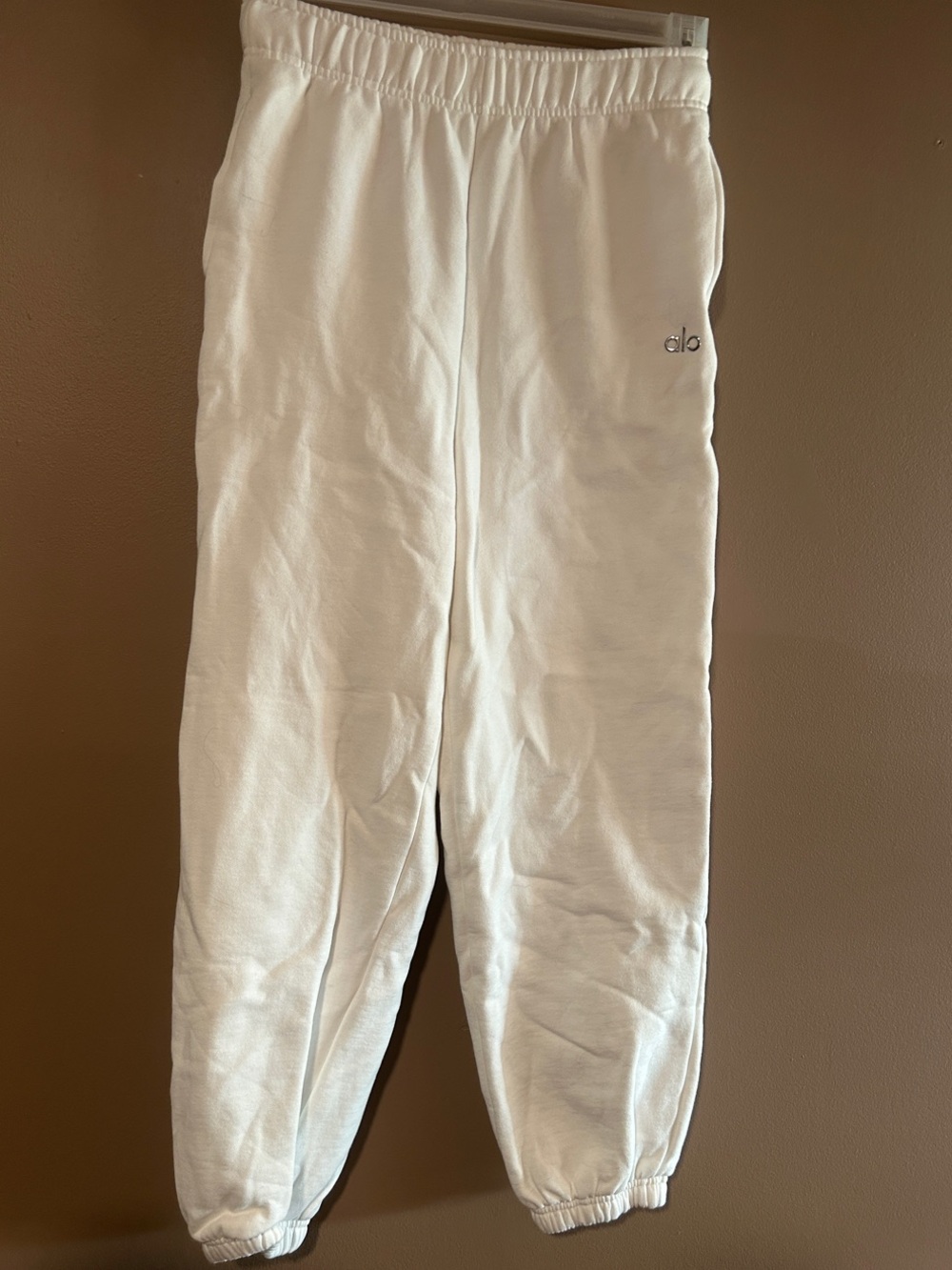 ALO Accolade White Jogger Pants with silver Logo